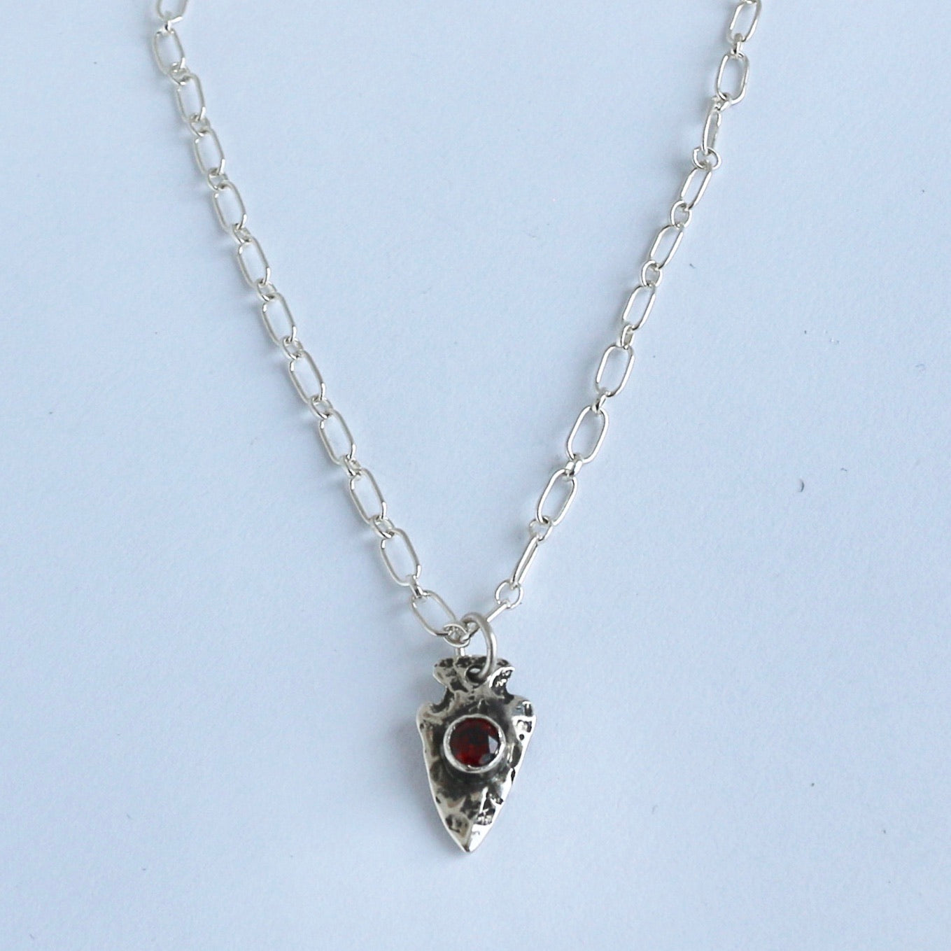Sterling Arrowhead with Garnet Pendant Pendants Richard Schmidt